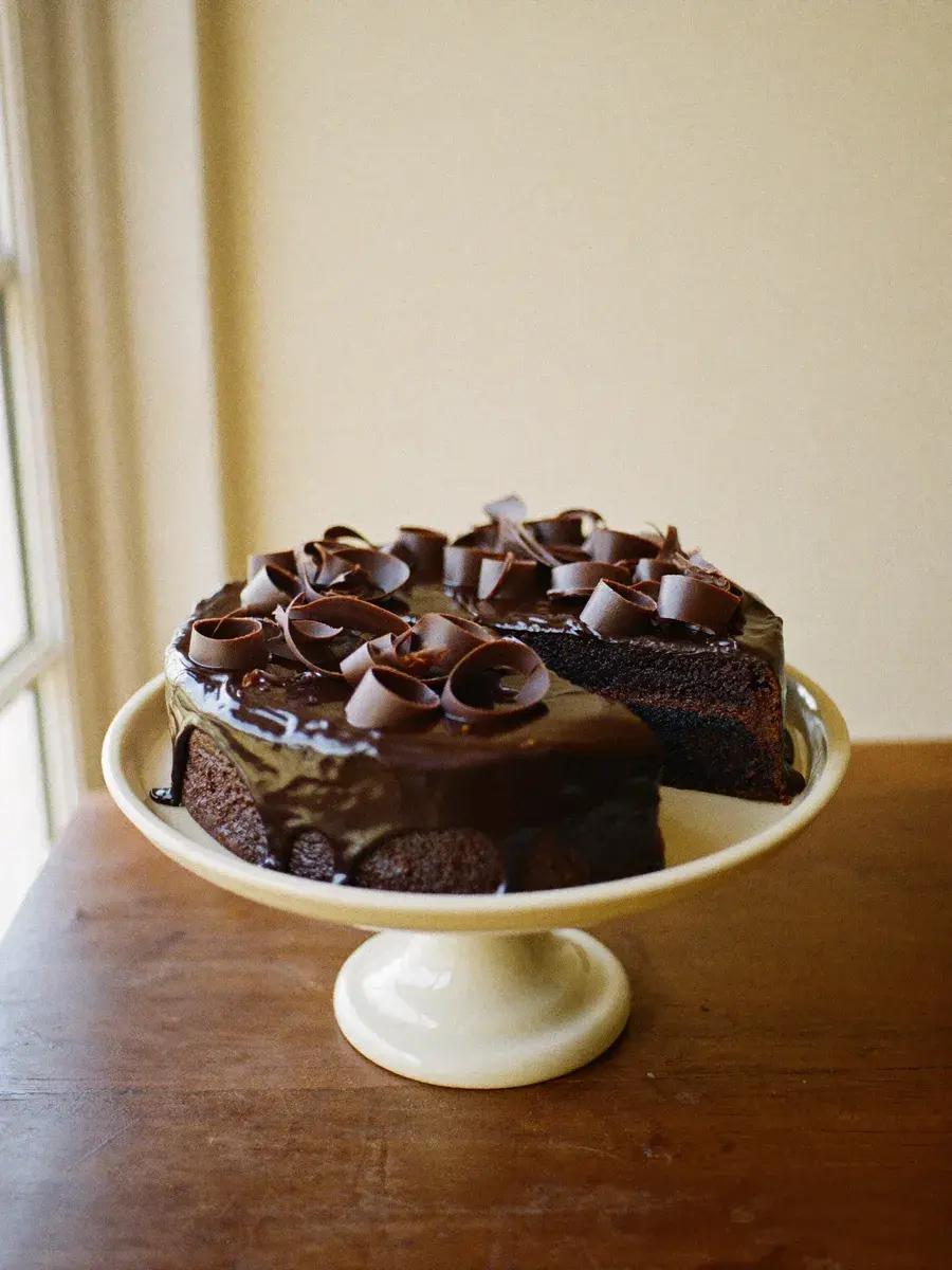 Cherai Chocolate — Dark cocoa sponge, chocolate ganache, finished with shaved Belgian chocolate.